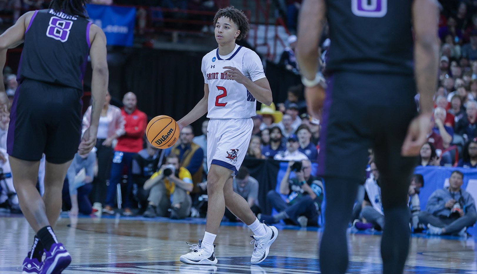 Men's basketball player Jordan Ross dribbles ball against GCU in 2024 NCAA Tournament