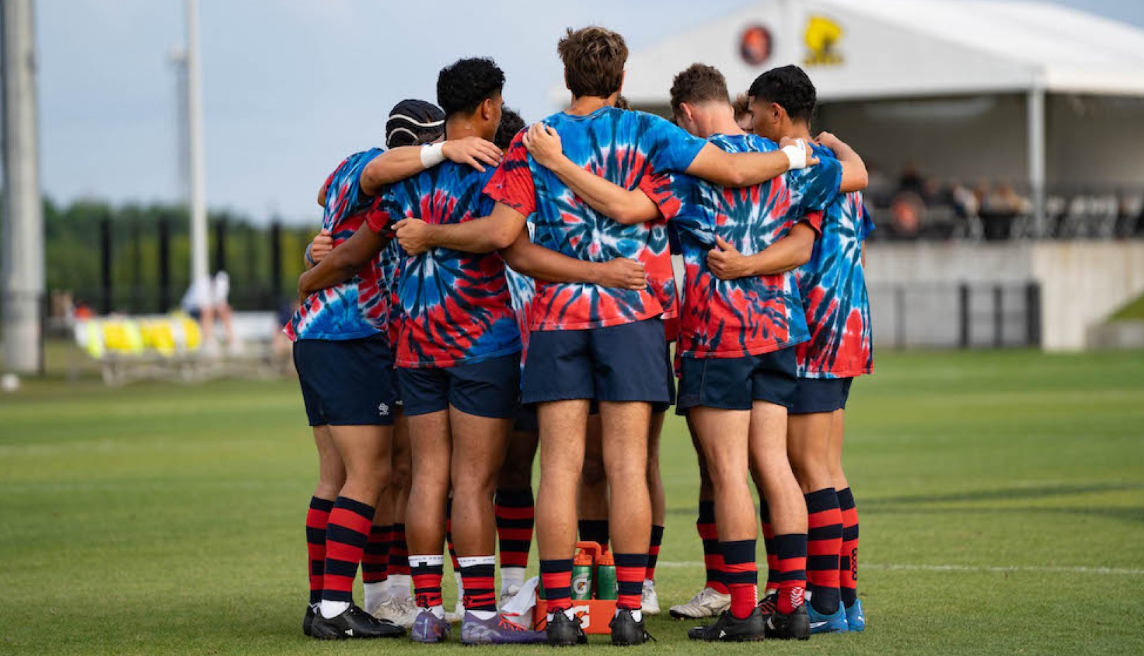 Gaels men's rugby players in practice tie-dyes before 2024 National Championships