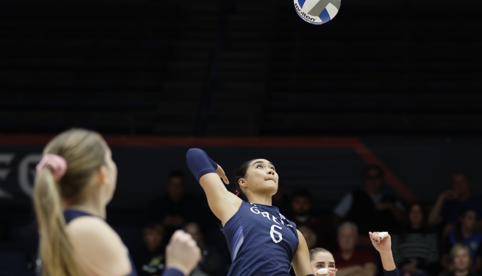 Women's Volleyball player hits ball in October 2024 match