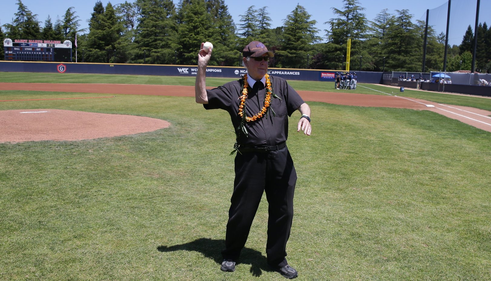 Br Ron throws out the first pitch