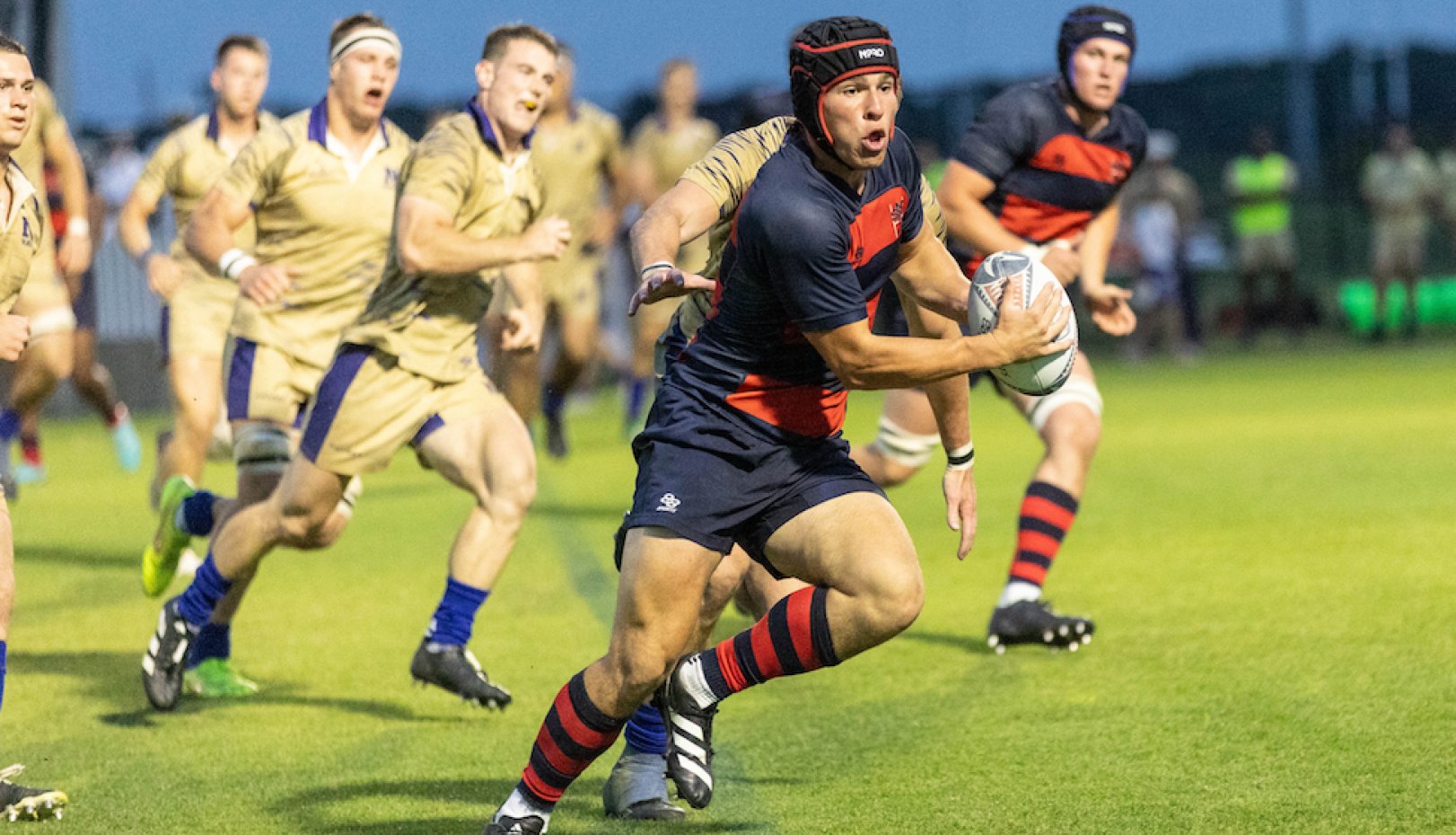 Dom Besag drives against Navy in the 2024 Rugby National Championship