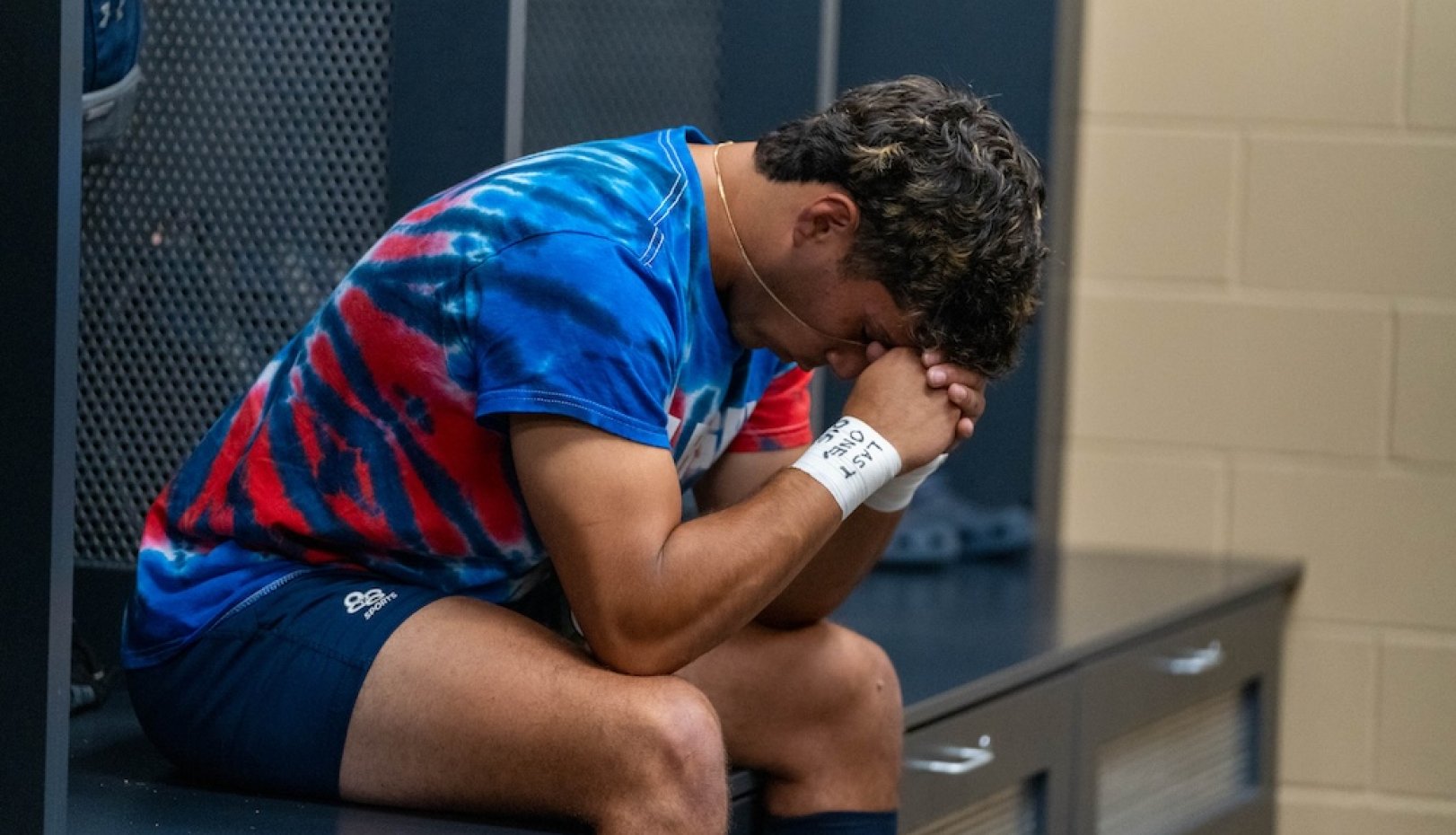 A Gael player in a moment of stillness in the locker room before 2024 Rugby National Championship