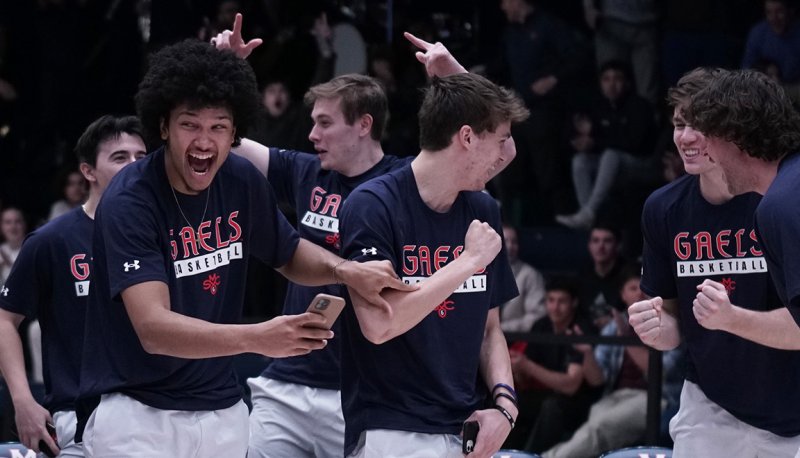 Men's basketball players celebrate on March 12 2023 as NCAA brackets are announced