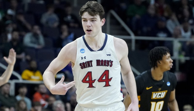 Basketball player Alex Ducas on the floor in Saint Mary's victory over VCU March 17, 2023