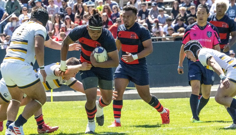 Two Saint Mary's rugby players run against UC Berkeley players on April 15 2023
