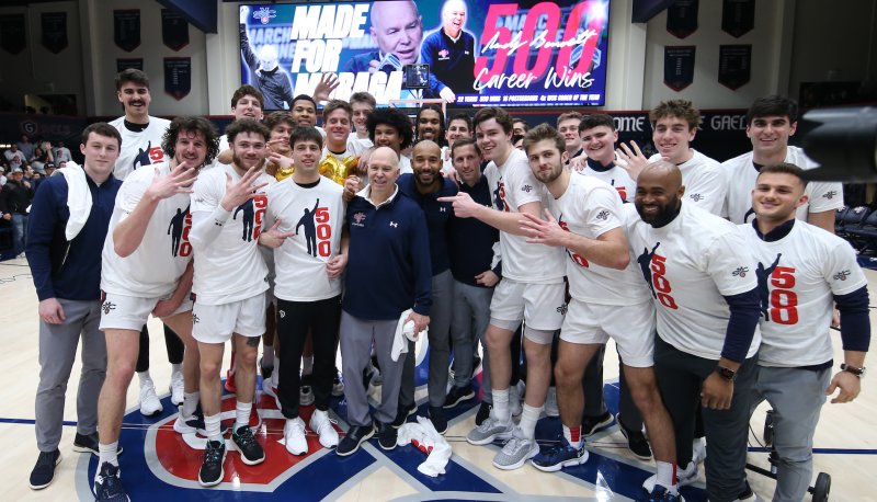 Men's Basketball Coach Randy Bennett and players celebrate 500 wins in February 2023