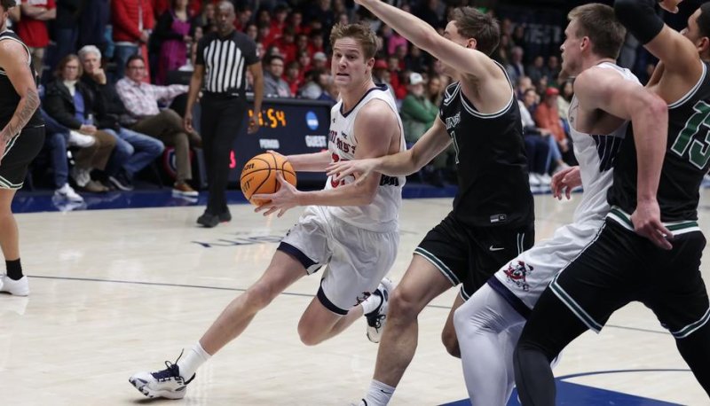 In men's basketball, Luke Barrett drives against Cleveland State in December 2023