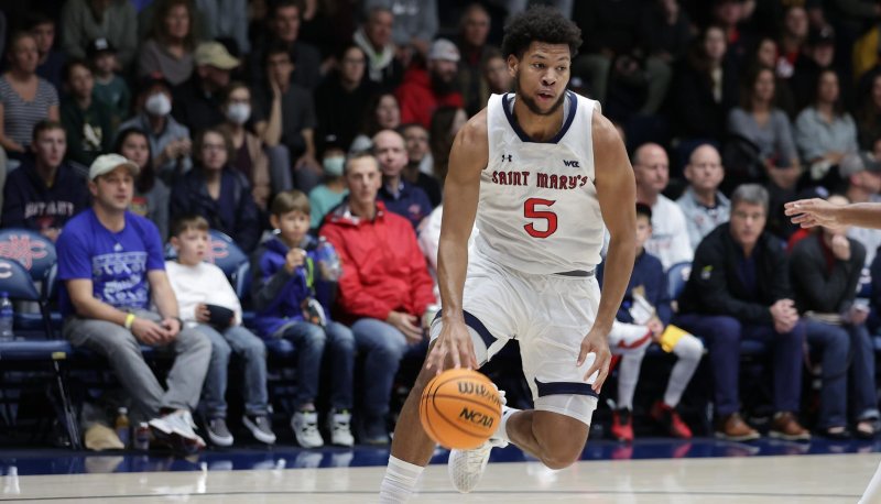 Men's Basketball player Joshua Jefferson drives against Portland in January 2024