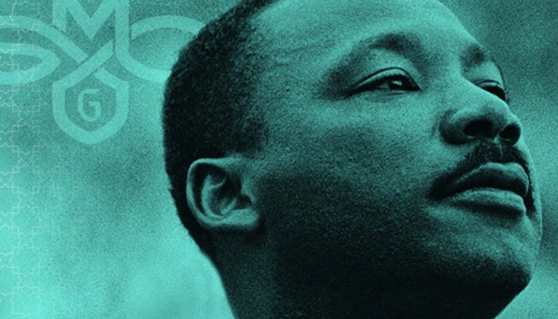 Martin Luther King Jr. with SMC logo in background
