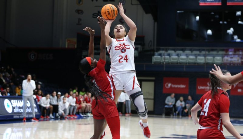 Women's basketball player Zeryhia Aokuso hanging in the air on pull up jumper against Portland in January 2024