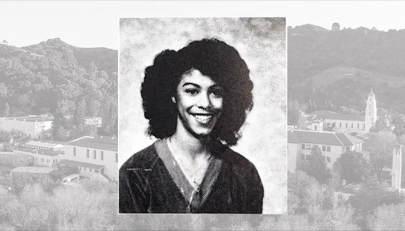 Headshot of Vicki Martin Smith '83 against a backdrop of the SMC campus