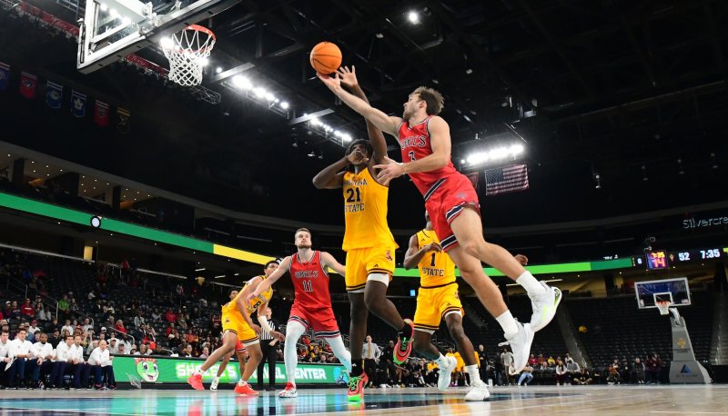Men's Basketball player Augustas Marciulionis goes for the basket as the Gaels do battle with the Sun Devils in November 2024
