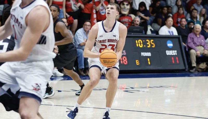 Men's Basketball Player Paulius Murauskas shoots against Towson State in November 2024