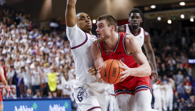 Men's basketball player Mitchell Saxen drives against Gonzaga in February 2025