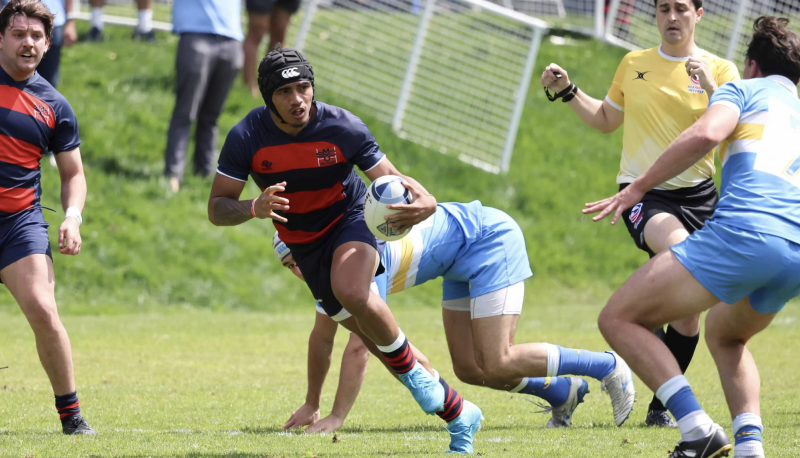 Men's Rugby Player Siale Ofa runs with the ball against UCLA in April 2025