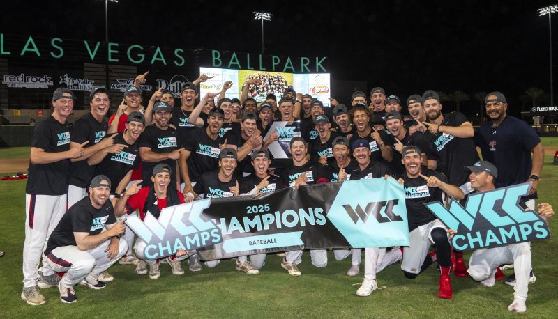 SMC Baseball team with WCC Championship banner in May 2025