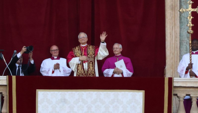 Pople Leo XIV waves from balcony on May 8, 2025