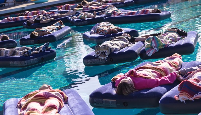 Students float in the pool at the Joseph L. Alioto Recreation Center as part of a Sound Healing Bath in 2025