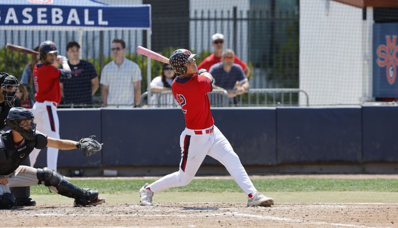 SMC baseball player hits at the plate