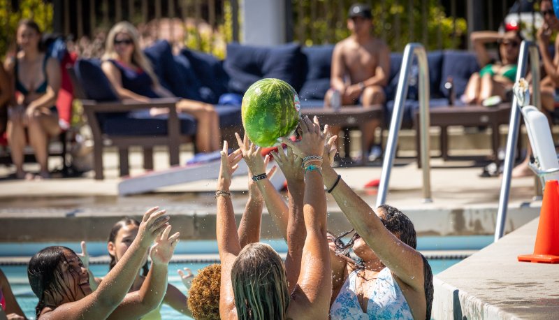 First Years Students at the Pool with a greased up water melon
