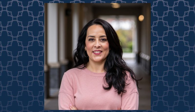María Luisa Ruiz headshot with blue pattern background