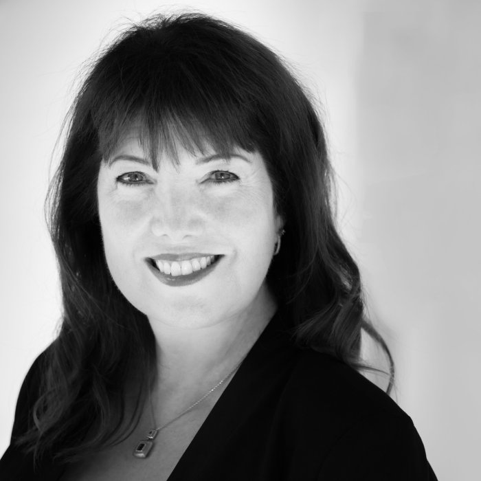 A black-and-white headshot of Dr. Julie Ford