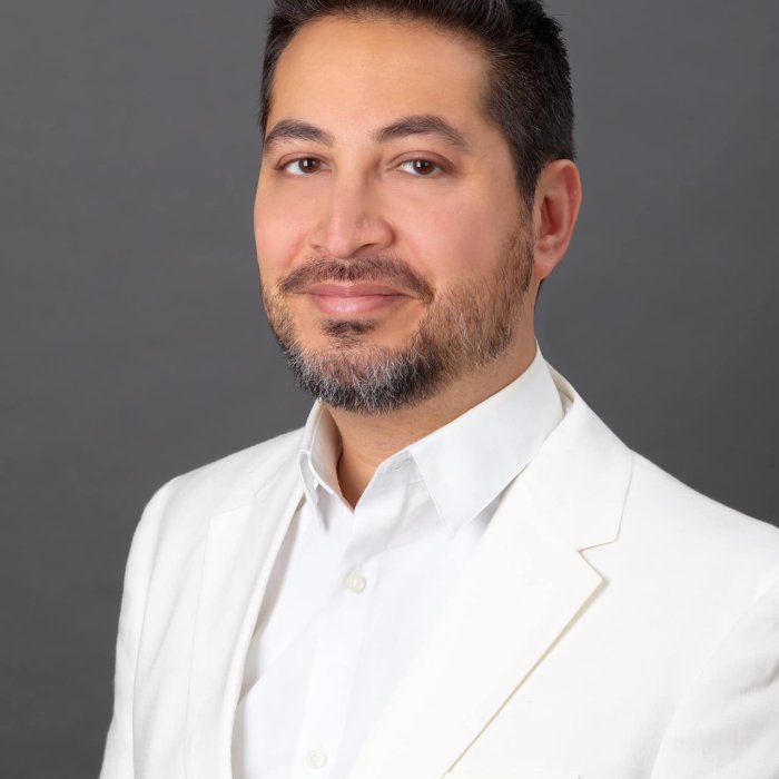 portrait of faculty wearing all white