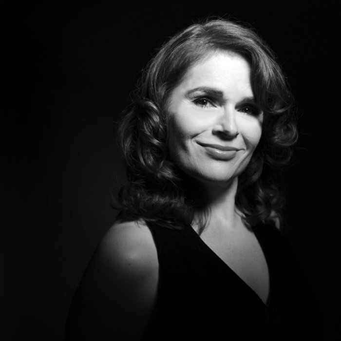 A black-and-white headshot of Amy Stabnau