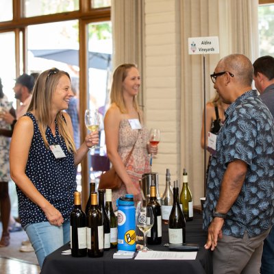 Two people share a laugh at the Summer Wine &amp; Beer Fest