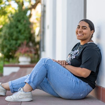 Rebecca Carranza seated on the chapel steps