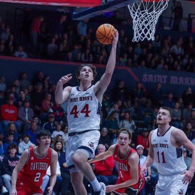 Men's basketball player Alex Ducas, No. 44, goes up for a basket against Davidson in November 2023