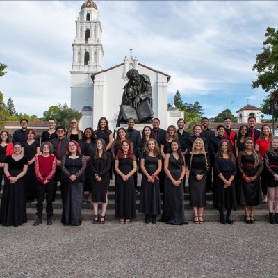 Choir members grouped together outside the chapel
