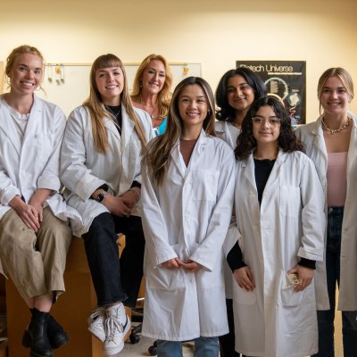Scientist Sonya Schuh and 7 students in her lab, December 2022