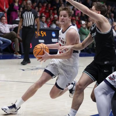 In men's basketball, Luke Barrett drives against Cleveland State in December 2023