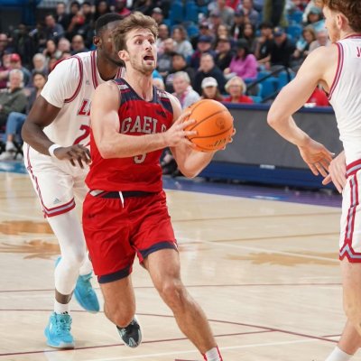 Men's basketball player Augustas Marciulionis drives against LMU in January 2024