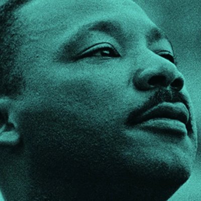 Martin Luther King Jr. with SMC logo in background