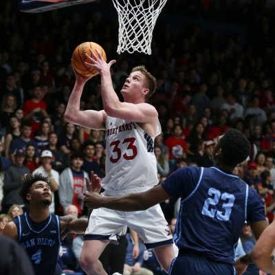 Men's Basketball player Luke Barrett shoots against San Diego in February 2024