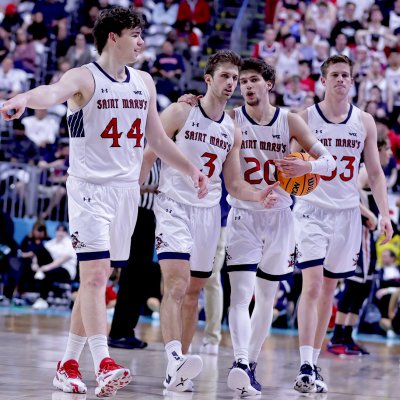 Five Saint Mary's men's basketball players on the court against Gonzaga in WCC Tournament Championship
