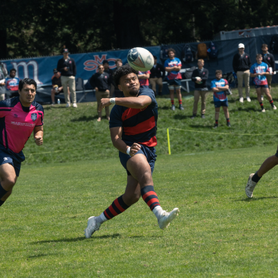 Inoke Waquavesi sends the Spiraling pass to his Rugby teammate