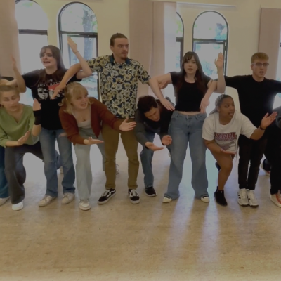 Acting 3 class arms entwined performing The Greek Chorus in the Acting studio.