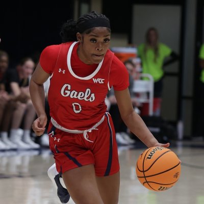 Women's Basketball player Jada Hunter drives against University of Denver in November 2024