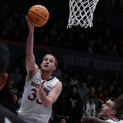 Men's basketball player Luke Barrett shoots against Pepperdine in January 2025
