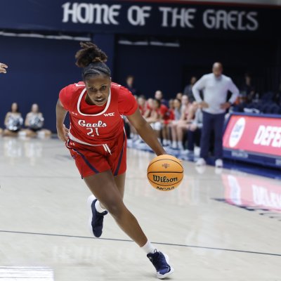 SMC Women's Basketball player Kennedy Johnson drives against LMU in January 2025