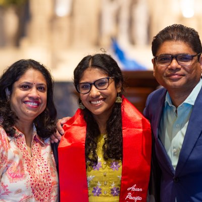 Students and parents posing at Asian Pacific Islander Graduate Celebration