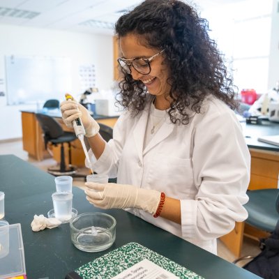 A student studying embryonic development in a lab