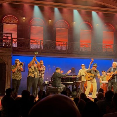 Nick Perez plays the piano amongst ten other band members