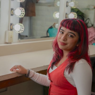 Bianca Langlois '27 posing in green room at LeFevre Theatre
