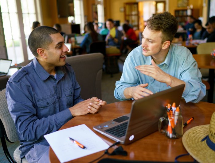 A wrtier and a Writing Adviser discussing a paper in the Writing Center