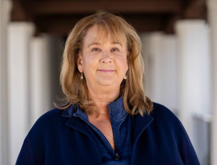 Picture of Cami West, blond hair wearing a blue sweater