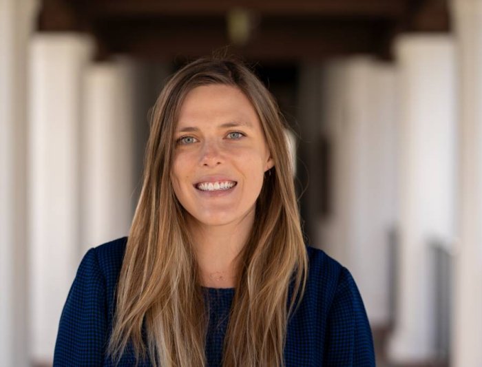 Picture of Emily Heier, long blond hair wearing a blue sweater